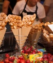 Egg bubble waffles wrapped by brown paper as street food