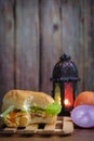 Egg burger, onion, eggs, tomato and lantern