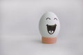 Egg cheerful with a face alone anecdote Royalty Free Stock Photo