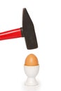 Egg cracking with hammer Royalty Free Stock Photo
