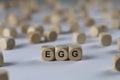 Egg - cube with letters, sign with wooden cubes