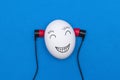 Egg with earphones. Royalty Free Stock Photo