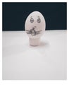 A egg face holding a hand wash