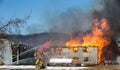 Egg farm fire.Firefighters battle blazing barn. Royalty Free Stock Photo