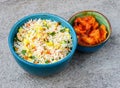Egg fried rice with sweet and sour chicken served in bowl isolated on background top view of asian food Royalty Free Stock Photo