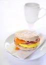 Egg, ham and cheese on whole wheat English muffin Royalty Free Stock Photo