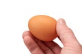 Egg on hand and eggs background for cooking, soft focus Royalty Free Stock Photo