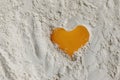 Egg heart on flour. I love to bake! Close-up of yolk on flour in the shape of a heart, full frame Royalty Free Stock Photo