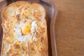 Egg in a hole and cheese toast serve on wooden board. Sandwiches for breakfast Royalty Free Stock Photo