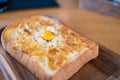 Egg in a hole and cheese toast serve on wooden board. Sandwiches for breakfast Royalty Free Stock Photo