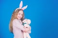 Egg hunt. Family holiday. Spring party. Little girl with hare toy. Happy easter. Child in rabbit bunny ears. copy space Royalty Free Stock Photo