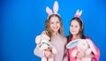 Egg hunt. Family and sisterhood. Spring holiday party. Little girls with hare toy. Happy easter. Children in rabbit Royalty Free Stock Photo