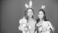 Egg hunt. Family and sisterhood. Spring holiday party. Little girls with hare toy. Happy easter. Children in rabbit Royalty Free Stock Photo