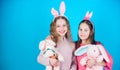 Egg hunt. Family and sisterhood. Spring holiday party. Little girls with hare toy. Happy easter. Children in rabbit Royalty Free Stock Photo