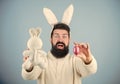 Egg hunt. Look what i found. Hipster cute bunny blue background. Easter bunny. My precious. Funny bunny with beard and
