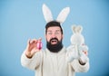 Egg hunt. Look what i found. Hipster cute bunny blue background. Easter bunny. My precious. Funny bunny with beard and