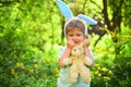 Egg hunt on spring holiday. Little boy child in green forest. love easter. Family holiday. Happy easter. Childhood Royalty Free Stock Photo