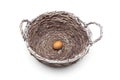 Egg lies in a large basket on a white background Royalty Free Stock Photo