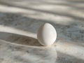 Egg on a marble surface Royalty Free Stock Photo