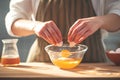 Egg mastery Womans hands separate yolks from whites with precision Royalty Free Stock Photo