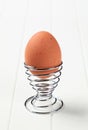 Egg in modern spiral metal egg cup Royalty Free Stock Photo