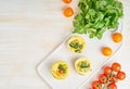 Egg muffins, paleo, keto diet. Omelet with spinach, vegetables, tomatoes baked in small molds, top view, copy space Royalty Free Stock Photo