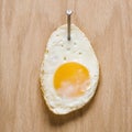 Egg nailed to wood. Royalty Free Stock Photo