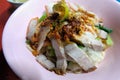 Egg noodle hot and sour soup with red roasted pork and crispy belly pork, Thailand street food. Royalty Free Stock Photo