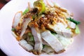 Egg noodle hot and sour soup with red roasted pork and crispy belly pork, Thailand street food. Royalty Free Stock Photo