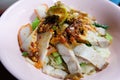 Egg noodle hot and sour soup with red roasted pork and crispy belly pork, Thailand street food. Royalty Free Stock Photo