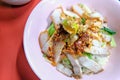 Egg noodle hot and sour soup with red roasted pork and crispy belly pork, Thailand street food. Royalty Free Stock Photo