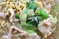 Egg noodle with pork kale and cabbage soaked in gravy.