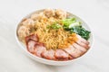 Egg noodle with red roast pork, crispy pork, dumplings and soup