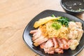 Egg noodle with red roast pork, crispy pork, dumplings and soup