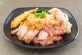 Egg noodle with red roast pork, crispy pork, dumplings and soup