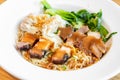 egg noodle with red roasted pork, crispy belly pork and wonton Royalty Free Stock Photo