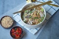 Egg noodle soup with many fresh vegetable and many topping, Thai noodle style