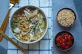 Egg noodle soup with many fresh vegetable and many topping, Thai noodle style