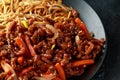 Egg noodles with bean sprouts and Crispy shredded beef on black plate Royalty Free Stock Photo
