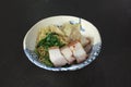 Egg Noodles with Crispy Roast Belly Pork and Wonton Dumplings  and Chinese Kale , Asian Food fusion style Royalty Free Stock Photo