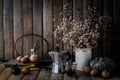 Egg, old coffee, dry little flowers, old badminton racket, bottle of sugar and hammer on wood table background Royalty Free Stock Photo