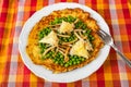 Egg omelette, pea, shimeji and cheese on white plate Royalty Free Stock Photo