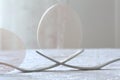 Egg over two forks as a monument close-up, macro Royalty Free Stock Photo