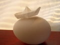 Egg & paper ship Royalty Free Stock Photo