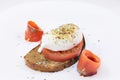 Egg poached with salmon fish and tomato