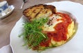 Egg on polenta and tomato sauce