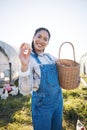 Egg, portrait and happy woman farming chicken in countryside for eco friendly dairy production. Natural sustainability