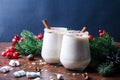 Egg punch, egg liqueur in glasses with Christmas decor. Eggnog Christmas drink in wine glasses on a brown blue background Royalty Free Stock Photo