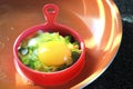 Egg roasted with broccoli in silicone mold, healhty homemade breakfast Royalty Free Stock Photo