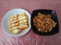 Egg rolls and stir-fried meatballs and tofu